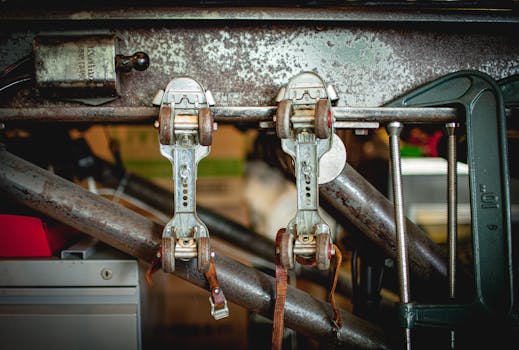 Close-up of antique roller skates hanging in a nostalgic workshop with a rustic feel.